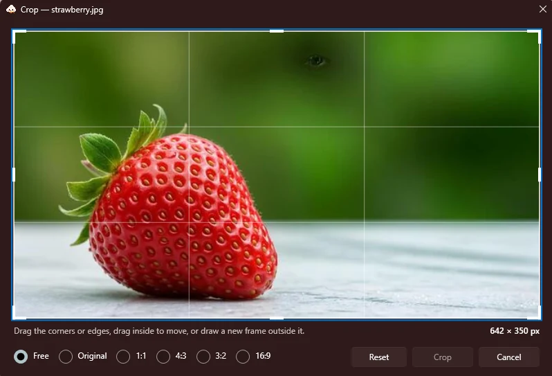 Kumo's crop editor showing a photo of a strawberry with crop handles, composition guides and aspect ratio presets